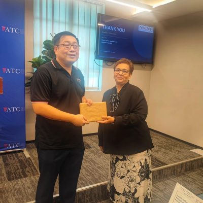 Ms Linda presenting a token of appreciation to Mr Ng Kian Nam after legal talk at ATC Penang
