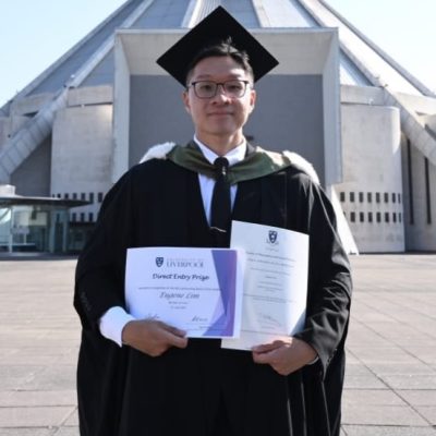 ATC UK Degree Transfer Programme graduate Eugene Lim holding the Direct Entry Prize at his University of Liverpool graduation